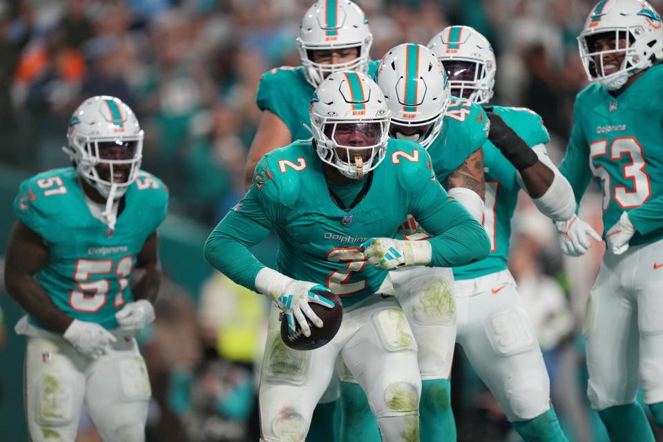 Miami Dolphins linebacker Bradley Chubb (2) celebrates recovering a fumble against the Tennessee Titans during the second half of an NFL game at Hard Rock Stadium in Miami Gardens, Dec. 11, 2023.