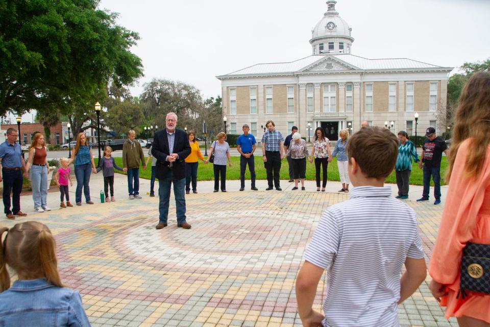 Steve Blackwelder, CEO of Citizens Defending Freedom, addresses supporters who formed a circle at Bartow's Fort Blount Park on Monday morning before the start of a news conference.