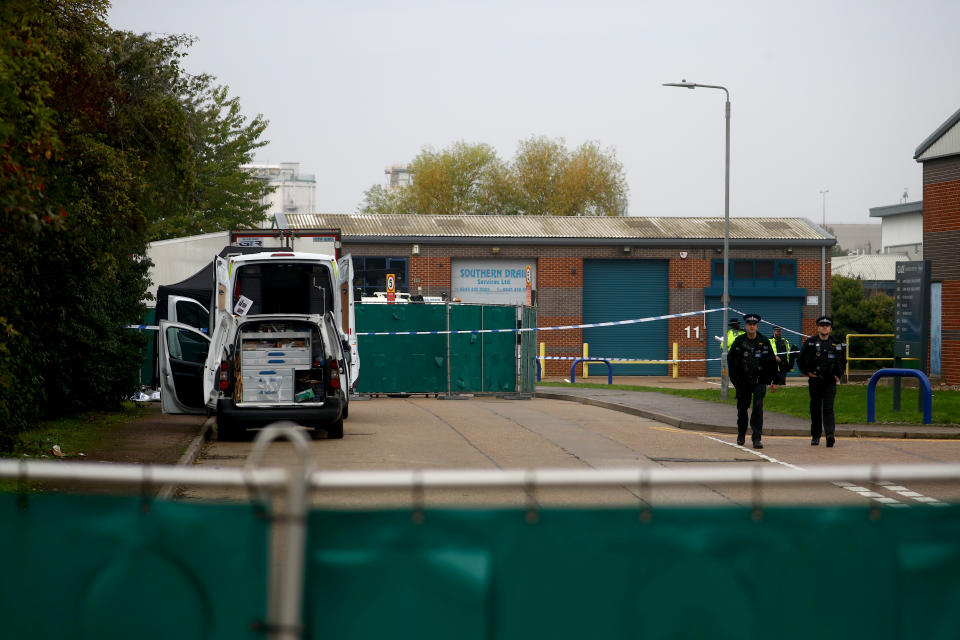 Police officers are seen at the scene where bodies were discovered in a lorry container, in Grays, Essex, Britain October 23, 2019.  REUTERS/Hannah McKay