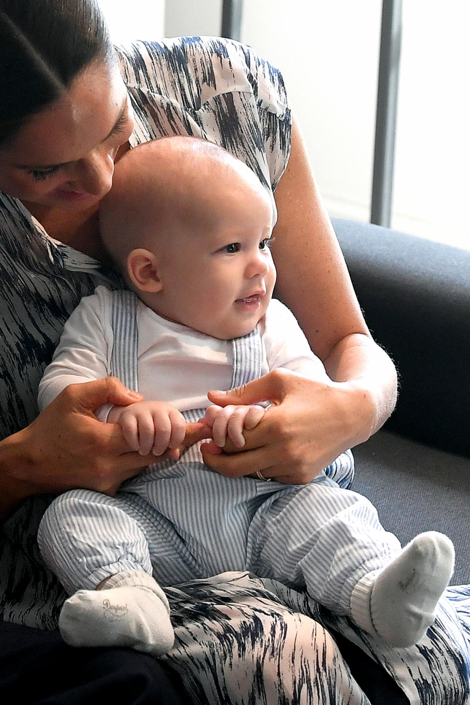 CAPE TOWN, SOUTH AFRICA - SEPTEMBER 25: Meghan, Duchess of Sussex holds her baby son Archie Mountbatten-Windsor as they meet Archbishop Desmond Tutu at the Desmond & Leah Tutu Legacy Foundation during their royal tour of South Africa on September 25, 2019 in Cape Town, South Africa. (Photo by Toby Melville - Pool/Getty Images)