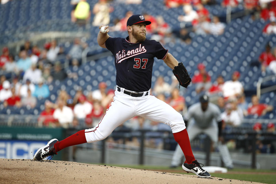 FILE - In this June 4, 2019, file photo, Washington Nationals starting pitcher Stephen Strasburg throws to the Chicago White Sox in the first inning of an interleague baseball game in Washington. Major League Baseball season shrunk down to just 60 games in the pandemic-shortened 2020 season. Last year, the Nationals played their 60th of 162 games on June 4 -- and came back to beat the visiting Chicago White Sox 9-5. (AP Photo/Patrick Semansky, File)