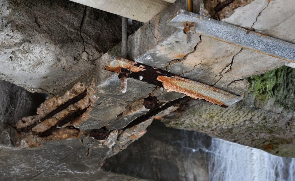 Crumbling concrete and exposed rebar are visible under a section of Bass River Bridge in a Nov. 17 photo. The state Department of Transportation says the bridge, opened in 1935, is "reaching the end of its useful lifespan and must be replaced."