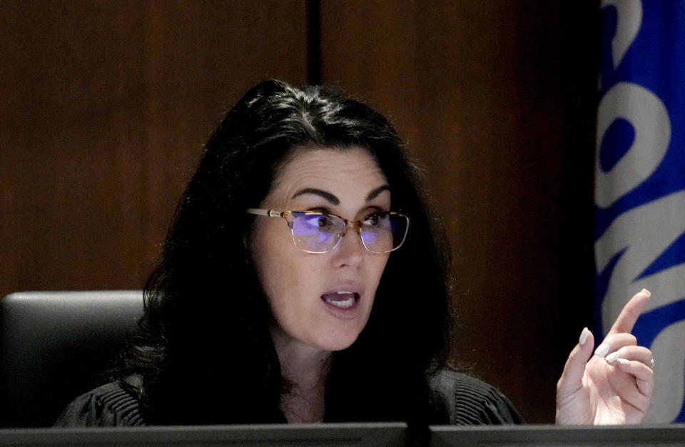 Waukesha County Circuit Court Judge Jennifer Dorow addresses Darrell Brooks during his trial in a Waukesha County Circuit Court in Waukesha, Wis., on Monday, Oct. 24, 2022. Brooks, who is representing himself during the trial, is charged with driving into a Waukesha Christmas Parade last year, killing six people and injuring dozens more. (Mike De Sisti/Milwaukee Journal-Sentinel via AP, Pool)