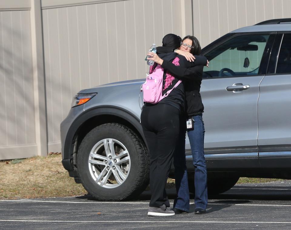 Lacey Bailey of the Sanford Police Department gets out of her car and receives an embrace from Carmelita Edgecomb at Gosnell Memorial Hospice House, where she is a resident.