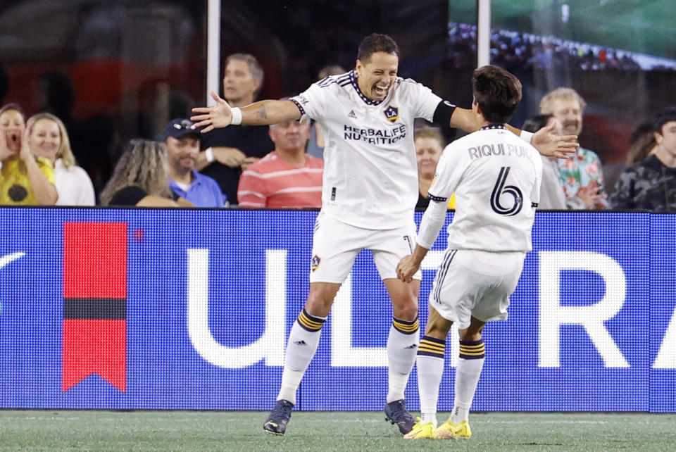 FOXBOROUGH, MA - AUGUST 28: Los Angeles Galaxy center forward Chicharito (14) celebrates his goal with Los Angeles Galaxy central midfielder Riqui Puig (6) during a match between the New England Revolution and the Los Angeles Galaxy on August 28, 2022, at Gillette Stadium in Foxborough, Massachusetts. (Photo by Fred Kfoury III/Icon Sportswire via Getty Images)