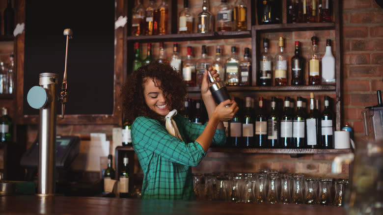 Bartender mixing drinks