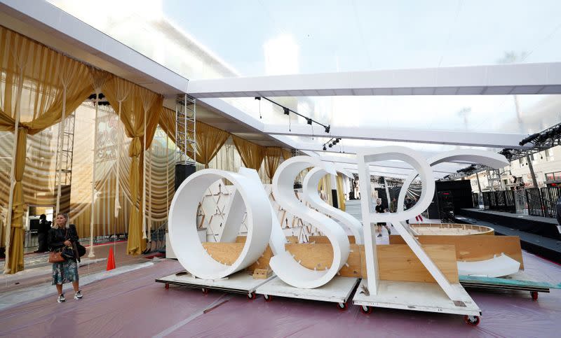 Workers set up the red carpet area in preparation for the 92nd Academy Awards outside Dolby theatre in Los Angeles