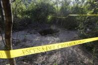 A clandestine grave is seen at Pueblo Viejo, in the outskirts of Iguala, southern Mexican state of Guerrero October 7, 2014. REUTERS/Henry Romero