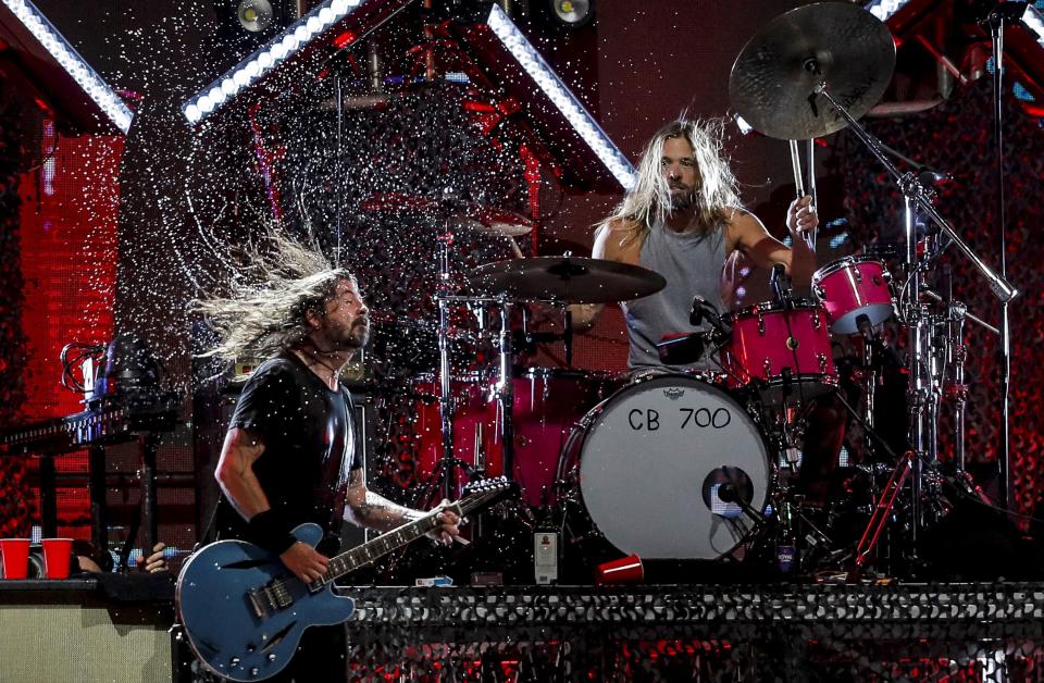 Dave Grohl and Taylor Hawkins onstage with Foo Fighters on March 18, 2022 - Credit: GI