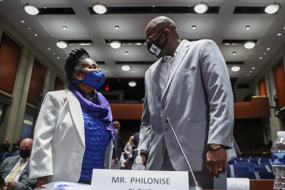 Philonise Floyd, a brother of George Floyd, speaks with Rep. Sheila Jackson Lee, D-Texas, after a lunch break for a House Judiciary Committee hearing on proposed changes to police practices and accountability on Capitol Hill, Wednesday, June 10, 2020, in Washington. (Michael Reynolds/Pool via AP)