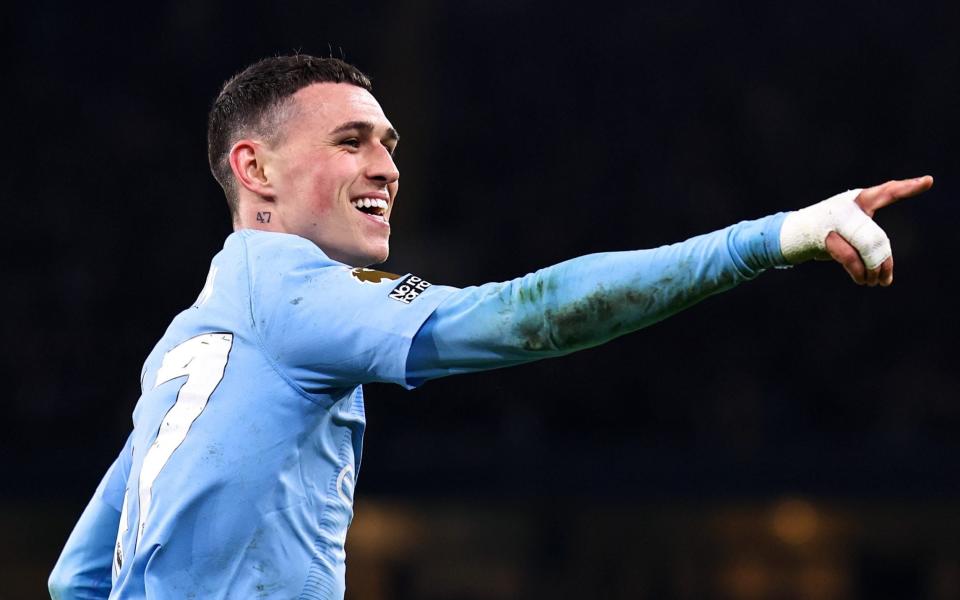 Phil Foden celebrates scoring against Aston Villa