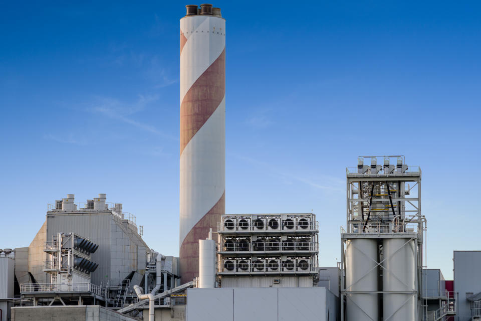 Image of carbon capture technology which uses filters to remove the green house gas carbon dioxide from the atmosphere. The big fans suck in air from the atmosphere and take out the green house gas carbon dioxide. This technology can solve the problem of climate change and help with the climate crisis.