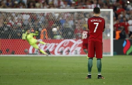 Football Soccer - Poland v Portugal - EURO 2016 - Quarter Final - Stade Velodrome, Marseille, France - 30/6/16 Portugal's Cristiano Ronaldo as Ricardo Quaresma takes a penalty during the shootout REUTERS/Yves Herman/ Livepic