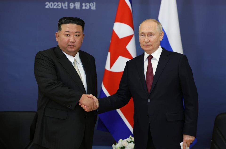 Vladimir Putin shakes hands with Kim Jong Un during their meeting at the Vostochny Cosmodrome outside the city of Tsiolkovsky, in the far eastern Amur region, Russia, on Wednesday 13 September (AP)