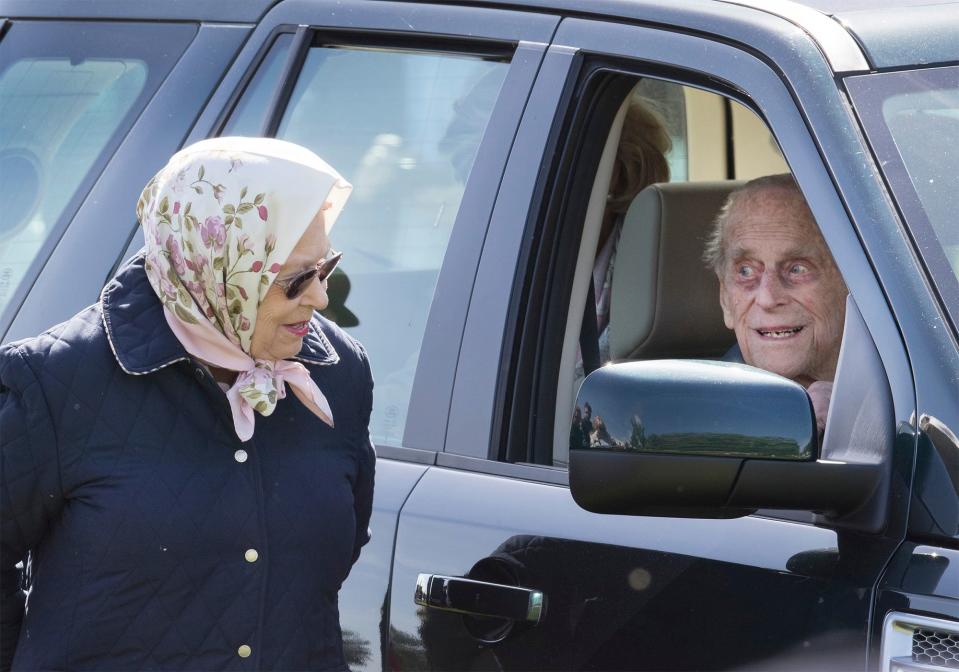 The Queen stops for a quick car-side chat with her husband at 2018 Royal Windsor Horse Show.
