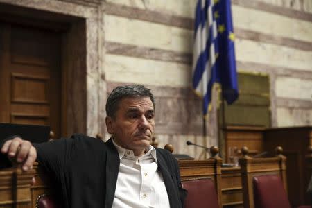 Greek Finance Minister Euclid Tsakalotos looks on before a parliamentary session in Athens, Greece July 22, 2015. REUTERS/Yiannis Kourtoglou