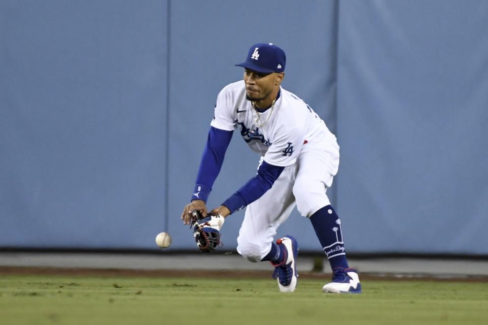 Dodgers right fielder Mookie Betts misplays a fly ball.