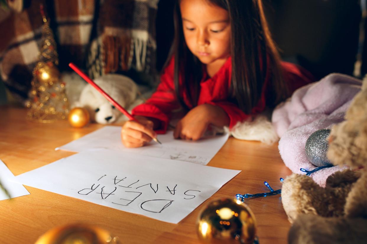 child writing letter to santa