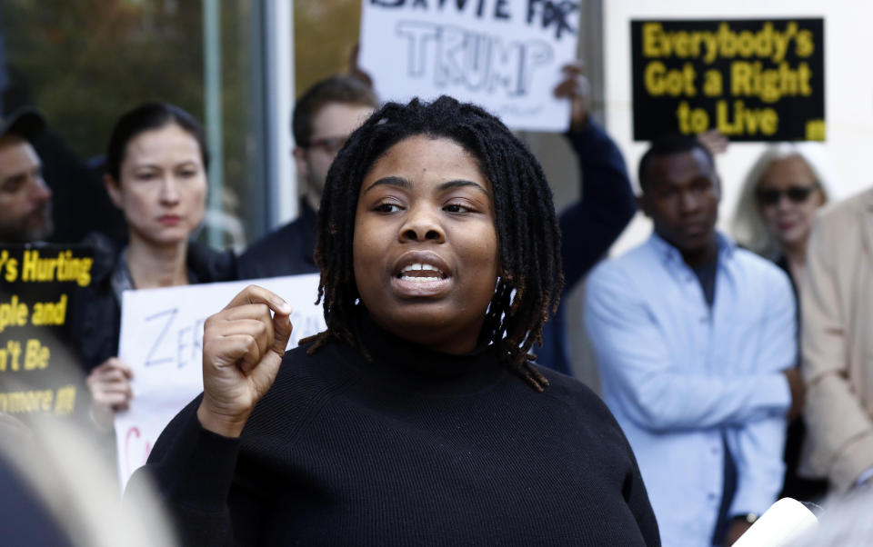 Leslyn Smith, a Jackson, Miss., high school senior, criticizes appointed U.S. Sen. Cindy Hyde-Smith, R-Miss., for her comments about "public hanging" and voting rights, during a protest outside the downtown complex that houses her office, on Friday, Nov. 16, 2018, in Jackson, Miss. A small group of protestors attended the press-conference calling for her removal from office. Hyde-Smith and Democrat Mike Espy are competing to serve the final two years of a six-year term started by Republican Thad Cochran, who retired. (AP Photo/Rogelio V. Solis)