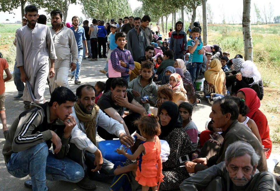 <p>Syrian refugees gather outside their camp after a fire tore through it, near the town of Qab Elias, in Lebanon’s Bekaa Valley, July 2, 2017. (Hassan Abdallah/Reuters) </p>