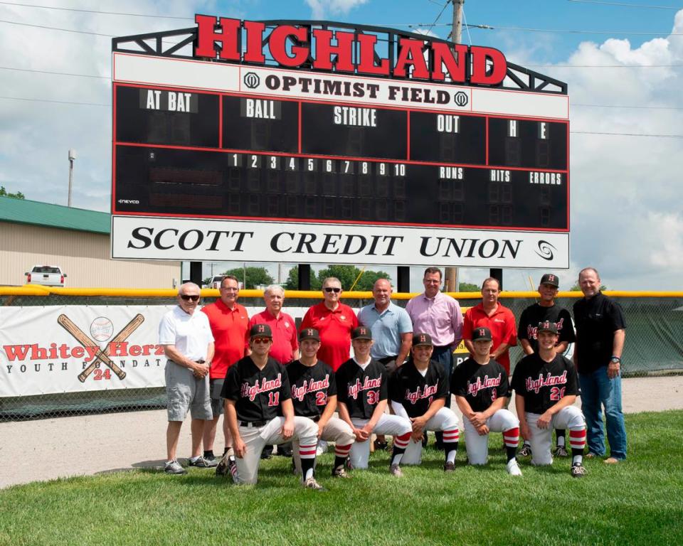 Baseball Hall of Famer Whitey Herzog made a stop at Optimist Field at Glik Park recently to check out the facility after a recent donation to a campaign to fund improvements. Bottom row, from left, are Highland Bulldog baseball players Luke Darling, Blaine Kapp, Trey Koishor, Bryce Iberg, Jon Walker, and Chad Barker; back row, Highland Area Community Foundation Executive Director Terry Riffel, Start A Rally For Optimist Field Campaign Fundraising Committee Chair Adam Koishor, Lee Iten Post 439 Baseball Chairman Wayne Wirz, Herzog, Highland Director of Parks & Recreation Mark Rosen, Focal Pointe Outdoor Solutions, Inc. President John Munie, Highland Parks & Recreation Manager Brad Koehnemann, and Start A Rally Campaign Coordinator Mike Riffel.