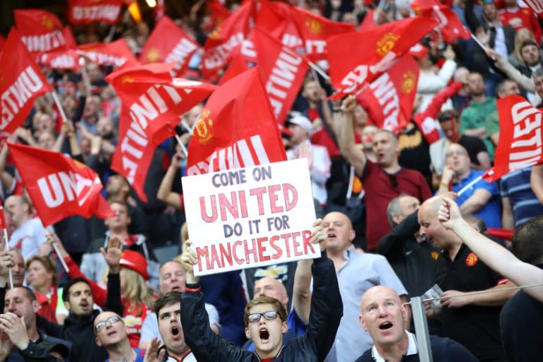 Supporters of Manchester United cheer during their UEFA Europa League final against Ajax Amsterdam on May 24, 2017 at the Friends Arena in Solna outside Stockholm