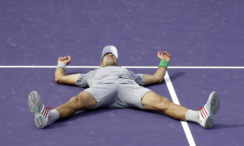 Novak Djokovic of Serbia, celebrates after defeating Rafael Nadal of Spain, 6-3, 6-3 during the men's final match at the Sony Open Tennis tournament on Sunday, March 30, 2014, in Key Biscayne, Fla. (AP Photo/Wilfredo Lee)