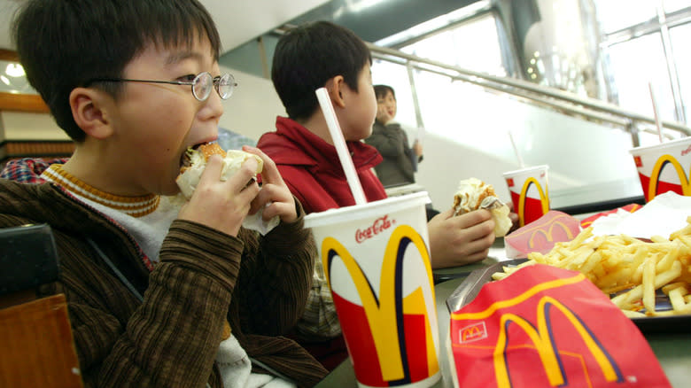 boy eating burger