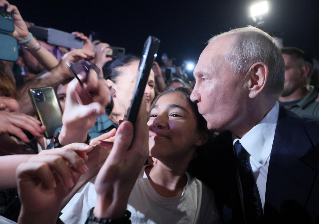 This is the first time Vladimir Putin has been seen interacting with a crowd since the COVID pandemic. (Getty)