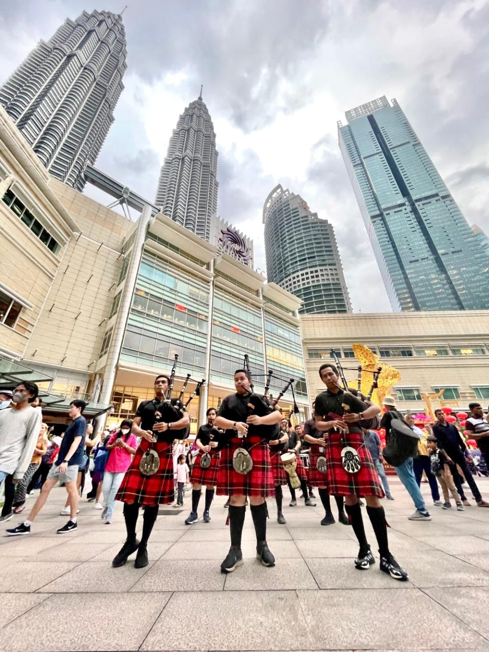 With Petronas Twin Towers as a stunning backdrop, the St John’s Alumni Pipe Band goes into action. — Picture courtesy of Albert Nico