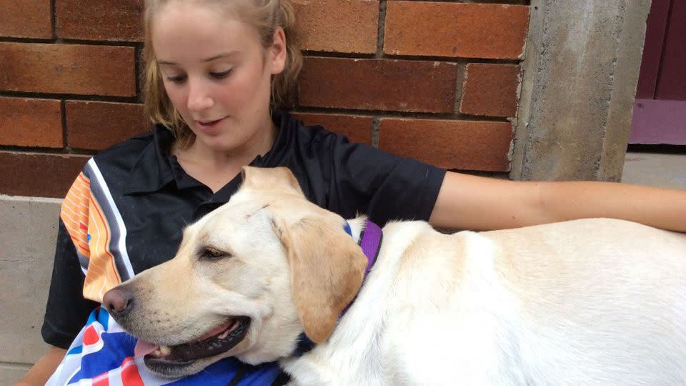 Emma's current assistance dog Bailee has to be retired for health issues and the cost of training the new assistance dog for Emma is anticipated to be between $25,000 and $30,000. Source: Facebook