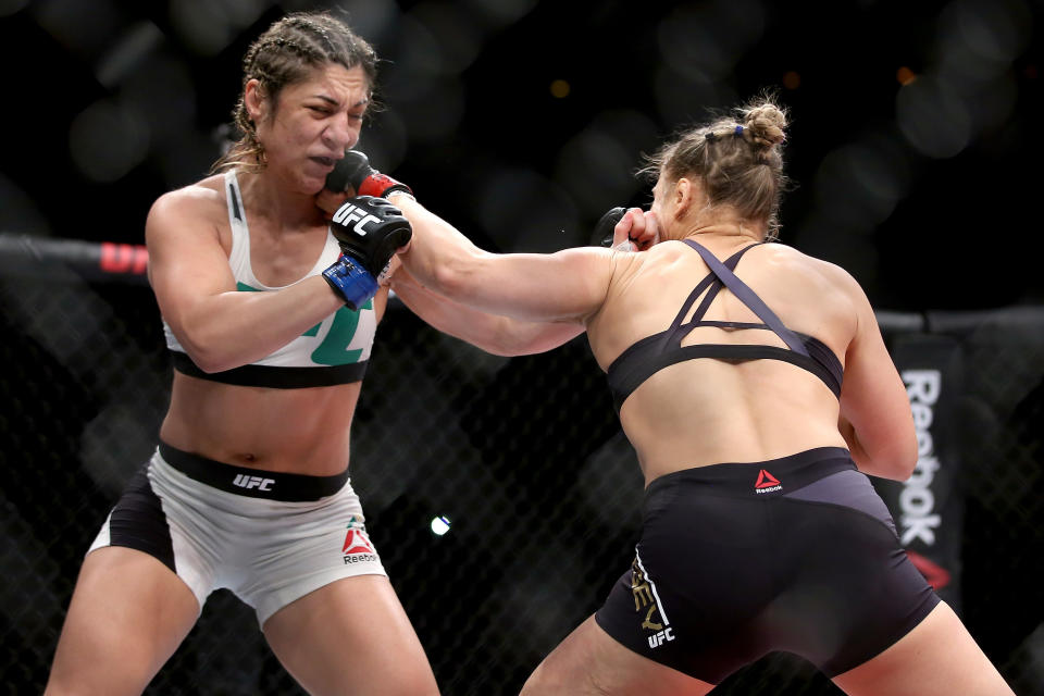 RIO DE JANEIRO, BRAZIL - AUGUST 01:  Ronda Rousey of the United States (red) fights Bethe Correia of Brazi (blue) l in their bantamweight title fight during the UFC 190 Rousey v Correia at HSBC Arena on August 1, 2015 in Rio de Janeiro, Brazil.  (Photo by Matthew Stockman/Getty Images)