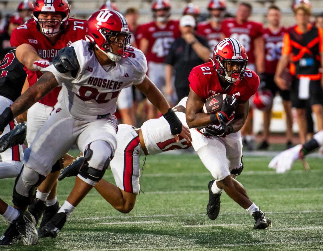 Indiana's Elijah Green (21) runs during the Indiana football spring game at Memorial Stadaium on Thursday, April 18, 2024.