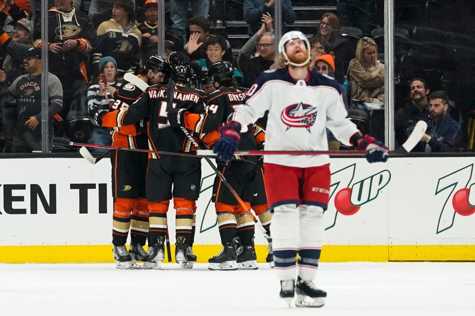 The Anaheim Ducks celebrate after a goal by center Gerry Mayhew during the first period of an NHL hockey game against the Columbus Blue Jackets in Anaheim, Calif., Sunday, April 17, 2022. Columbus Blue Jackets right wing Jakub Voracek, right, reacts. (AP Photo/Ashley Landis)