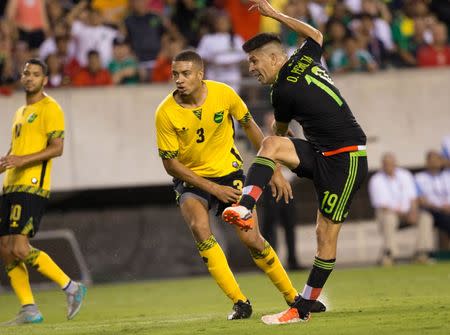 Philadelphia, PA, USA; Mexico forward Oribe Peralta (19) scores a goal against Jamaica during the second half of the CONCACAF Gold Cup final match at Lincoln Financial Field. Mexico won 3-1. Bill Streicher-USA TODAY Sports