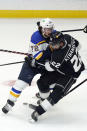 St. Louis Blues defenseman Justin Faulk (72) collides with Los Angeles Kings center Andreas Athanasiou (22) during the first period of an NHL hockey game Friday, March 5, 2021, in Los Angeles. (AP Photo/Marcio Jose Sanchez)