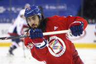 FILE - New York Rangers' Mika Zibanejad wears a Pride-themed jersey in warmups prior to an NHL hockey game against the Washington Capitals Monday, May 3, 2021, in New York. At least one National Hockey League team with a Russian player on its roster has decided against wearing special warmup jerseys to commemorate Pride Night because of a Russian law that expands restrictions on activities seen as promoting LGBTQ rights. (Bruce Bennett/Pool Photo via AP, File)