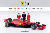 Ferrari's drivers Charles Leclerc and Sebastian Vettel pose with Ferrari team principal Mattia Binotto next to the new Ferrari Formula One race car