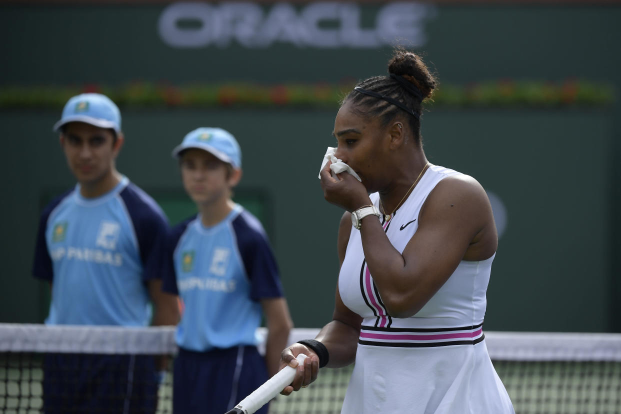 Serena Williams leaves the court, retiring with a medical issue, during her match against Garbine Muguruza, of Spain, at the BNP Paribas Open tennis tournament Sunday, March 10, 2019, in Indian Wells, Calif. (AP Photo/Mark J. Terrill)