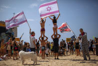 People protest against government's decision to close beaches during the three-week nationwide lockdown due to the coronavirus pandemic, in Tel Aviv, Israel, Saturday, Sept 19, 2020. Israel went back into a full lockdown on Friday to try to contain a coronavirus outbreak that has steadily worsened for months as its government has been plagued by indecision and infighting. (AP Photo/Oded Balilty)