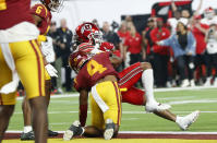 Utah wide receiver Jaylen Dixon, top right, pushes past Southern California defensive back Max Williams (4) for a touchdown during the first half of the Pac-12 Conference championship NCAA college football game Friday, Dec. 2, 2022, in Las Vegas. (AP Photo/Steve Marcus)