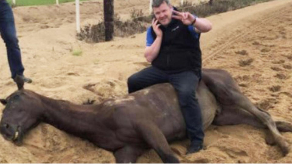 Irish horse trainer Gordon Elliott is pictured sitting on a dead horse in an undated image, which he has since confirmed is legitimate and is now subject to an investigation from racing authorities. Picture: Instagram