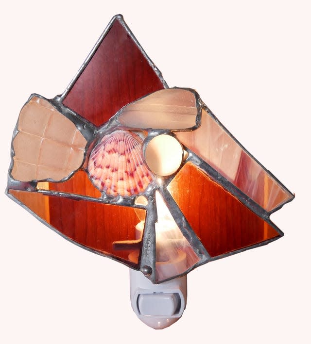 A nightlight made with stained glass, vintage glass and seashell, by Luisa DeLuca of Artists Fusion.