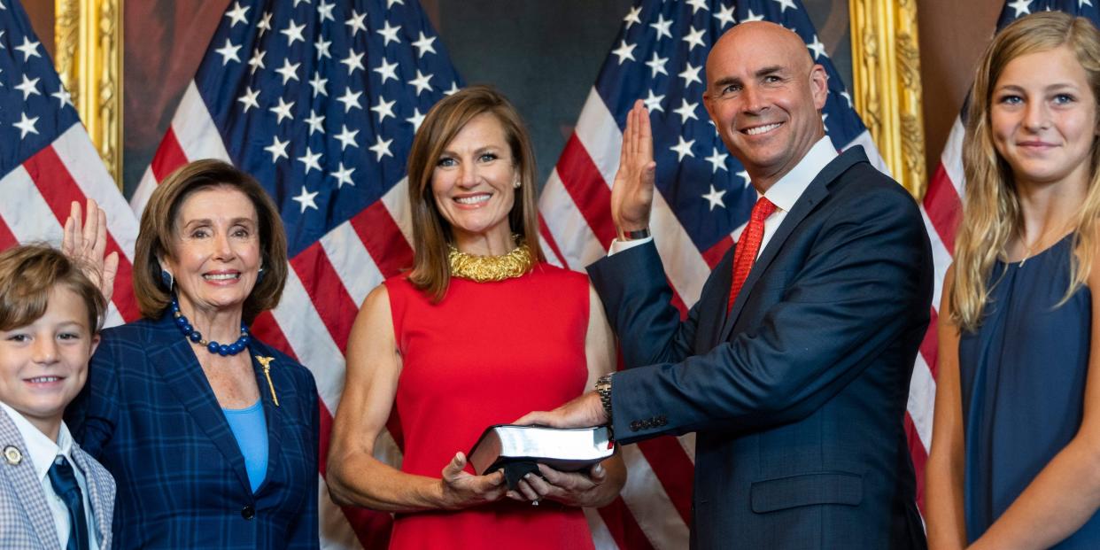 Newly-elected Rep. Jake Ellzey (R-TX) and his family participate in a ceremonial swearing-in with Speaker of the House Nancy Pelosi (D-CA) at the U.S. Capitol on July 30, 2021 in Washington, DC.