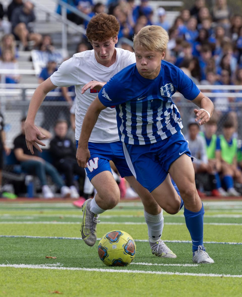 Holmdel Stephan Kapranov races towards goal as Wall Ryan Gotsch tries to cover him. Holmdel Boys Soccer defeats Wall 1-0 in State Sectional Finals in Holmdel NJ on November 5, 2022. 