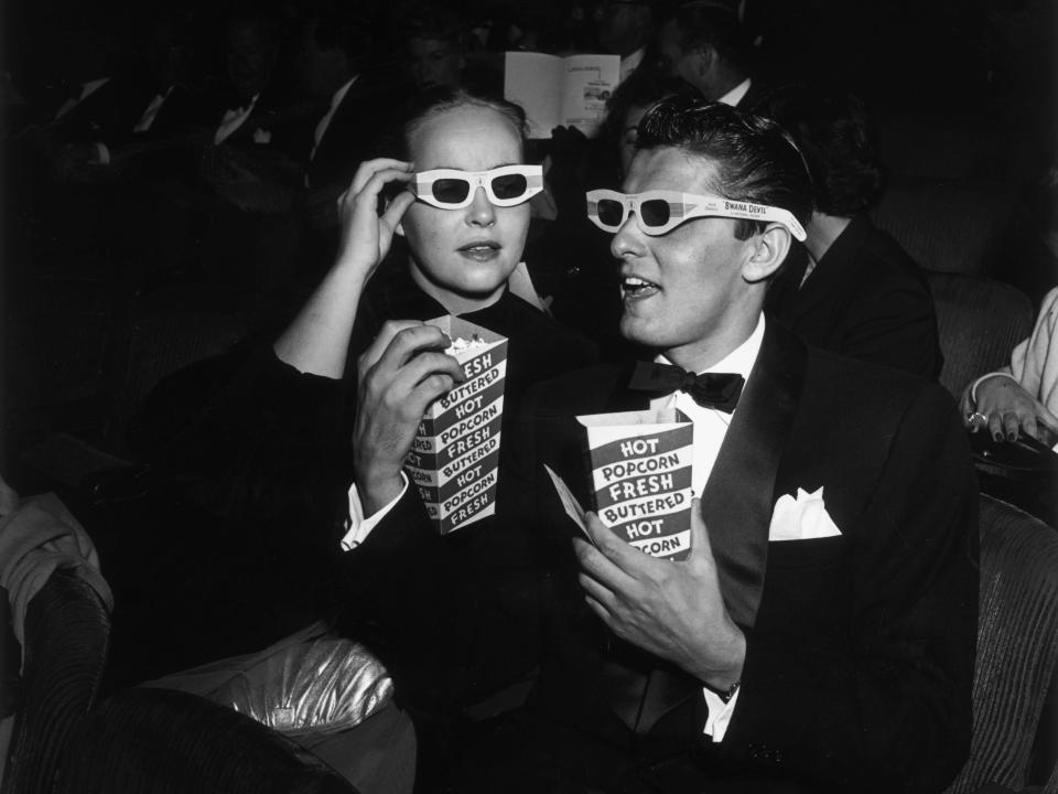 Two people attend a 3D movie in 1952.