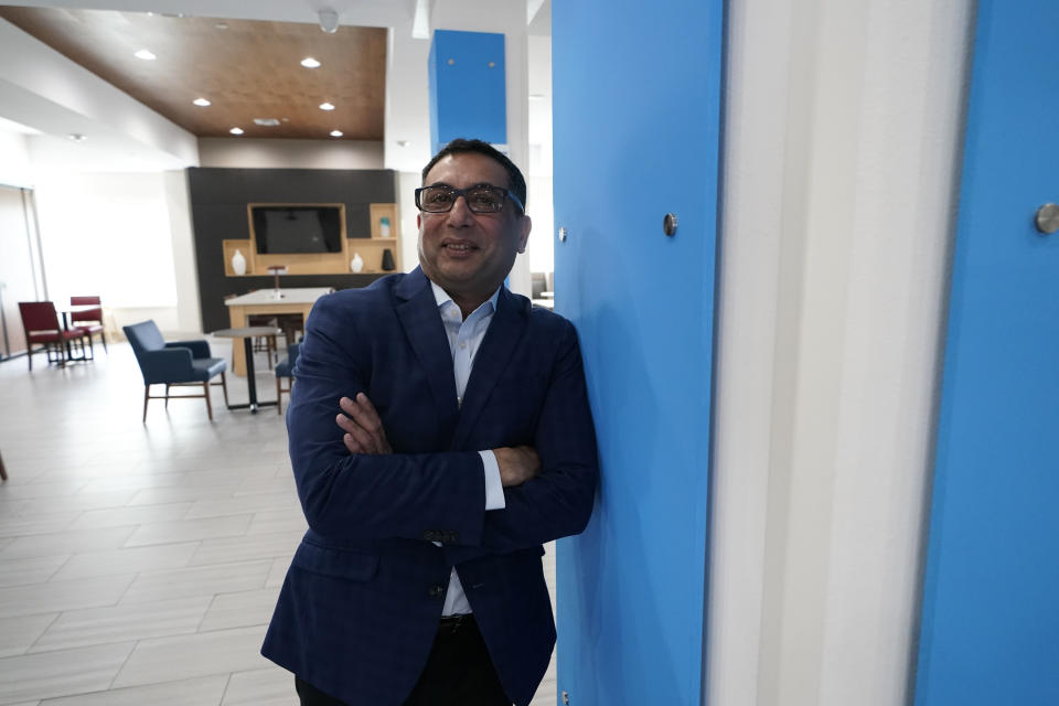 Vimal Patel president of Q Hotels, poses for a photograph at his Holiday Inn Express Hotel in LaPlace, La., Wednesday, June 23, 2021. (AP Photo/Gerald Herbert)