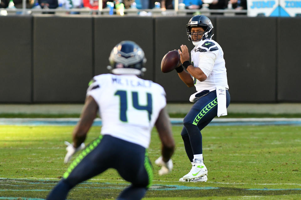 CHARLOTTE, NC - DECEMBER 15: Seattle Seahawks quarterback Russell Wilson (3) looks to pass to Seattle Seahawks wide receiver D.K. Metcalf (14) during the game between the Seattle Seahawks and the Carolina Panthers on December 15, 2019 at Bank of America Stadium in Charlotte,NC. (Photo by Dannie Walls/Icon Sportswire via Getty Images)