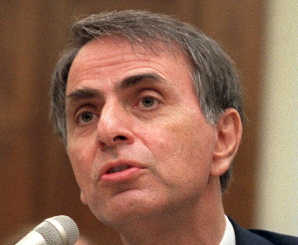 FILE - In this Aug. 1996 file photo, astronomer Carl Sagan speaks in Washington. The Library of Congress has acquired the personal papers of the late scientist and astronomer Carl Sagan, thanks to the generosity of a well-heeled admirer: “Family Guy” creator Seth MacFarlane. The writer, director and actor is working on a follow-up to Sagan’s acclaimed “Cosmos” miniseries, which introduced a mass audience to the mysteries of the universe and the origins of life. MacFarlane says he was profoundly influenced by “Cosmos” and wants to draw attention to the need for continued exploration of space and study of astronomy. (AP Photo/John Duricka, File)