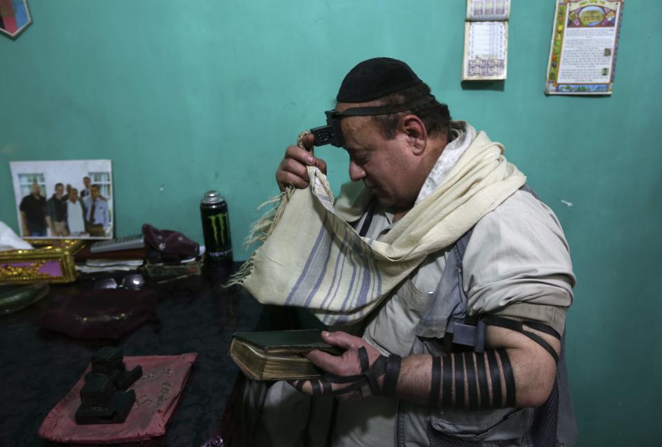 Simantov, an Afghan Jew, prays at his residence in Kabul